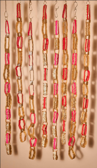 Festive Lambi and silk fabric hangings.