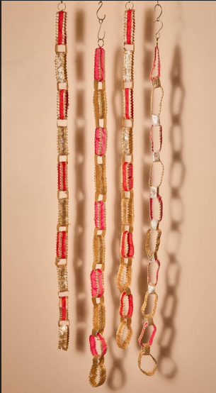 Festive Lambi and silk fabric hangings.